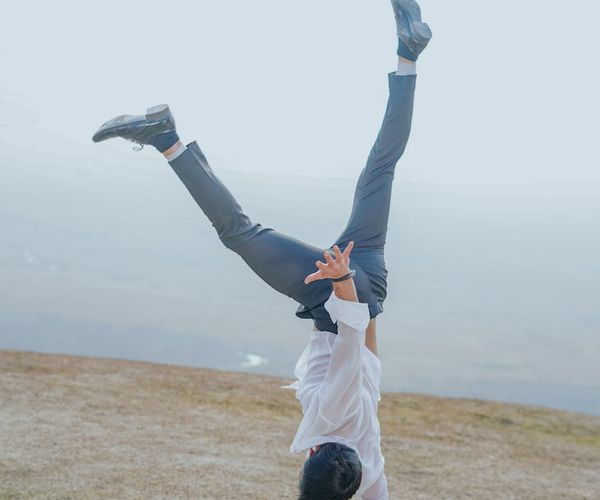 Athletic man performing a controlled bodyweight exercise.